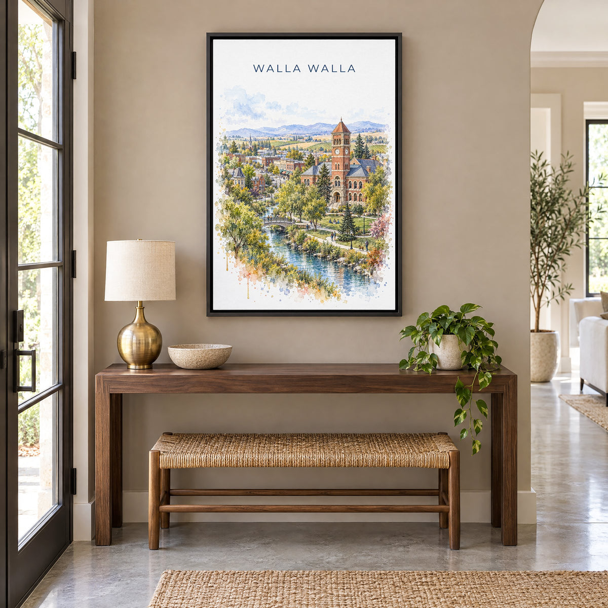 Walla Walla watercolor print as a black floater canvas above a walnut console and woven bench in an entryway