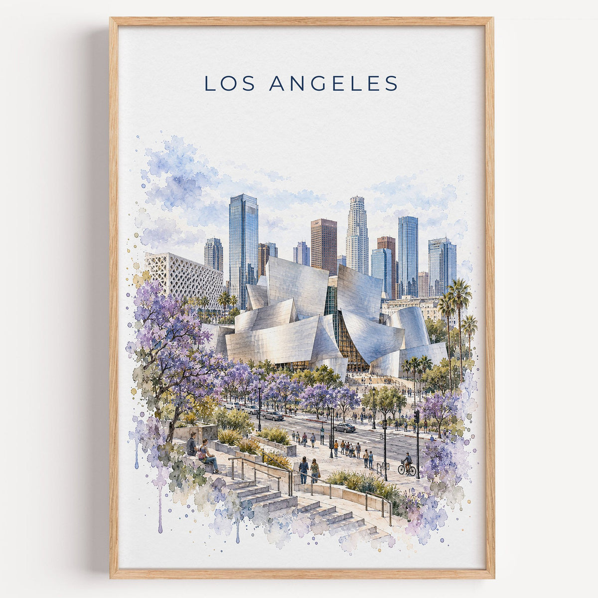 Walt Disney Concert Hall watercolor print in a light oak frame on a plain white wall