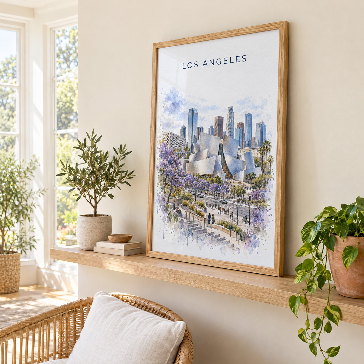 Walt Disney Concert Hall watercolor print in an oak frame on a picture ledge in a sunlit sunroom