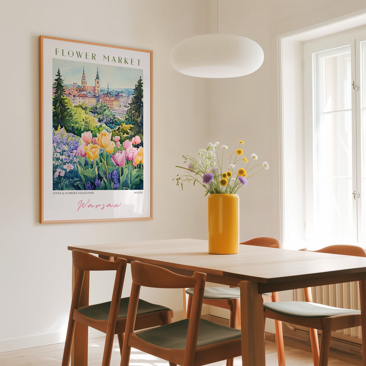 Warsaw flower market print in an oak frame above a dining table with a yellow vase and white pendant light