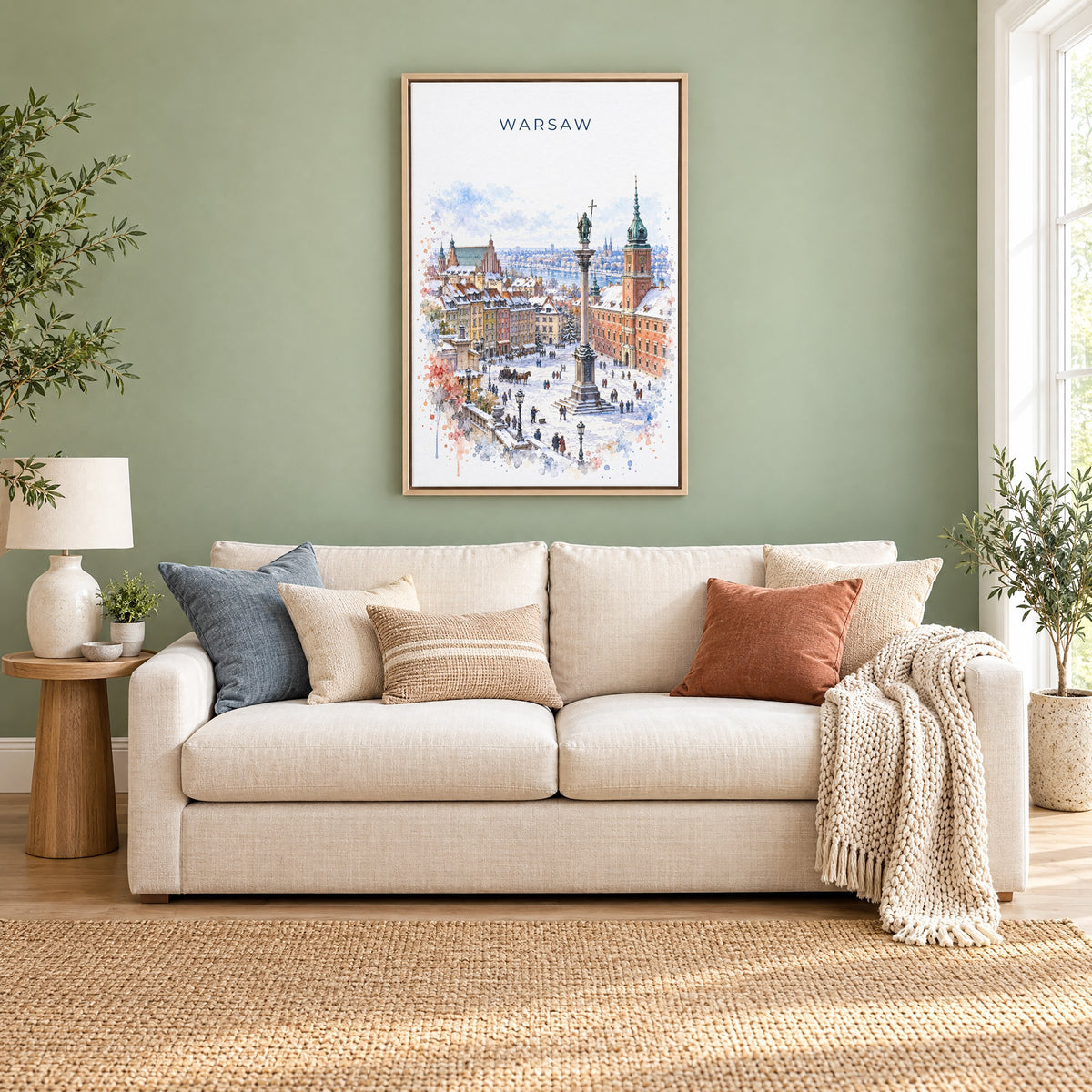 Warsaw watercolor print as a natural floater canvas above a cream linen sofa on a sage green wall