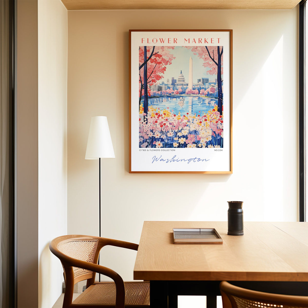 Washington DC flower market print in an oak frame above a dining table and cane chair