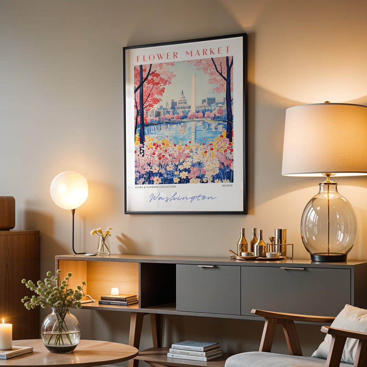 Washington DC flower market print in a black frame above a grey media console with a glass table lamp