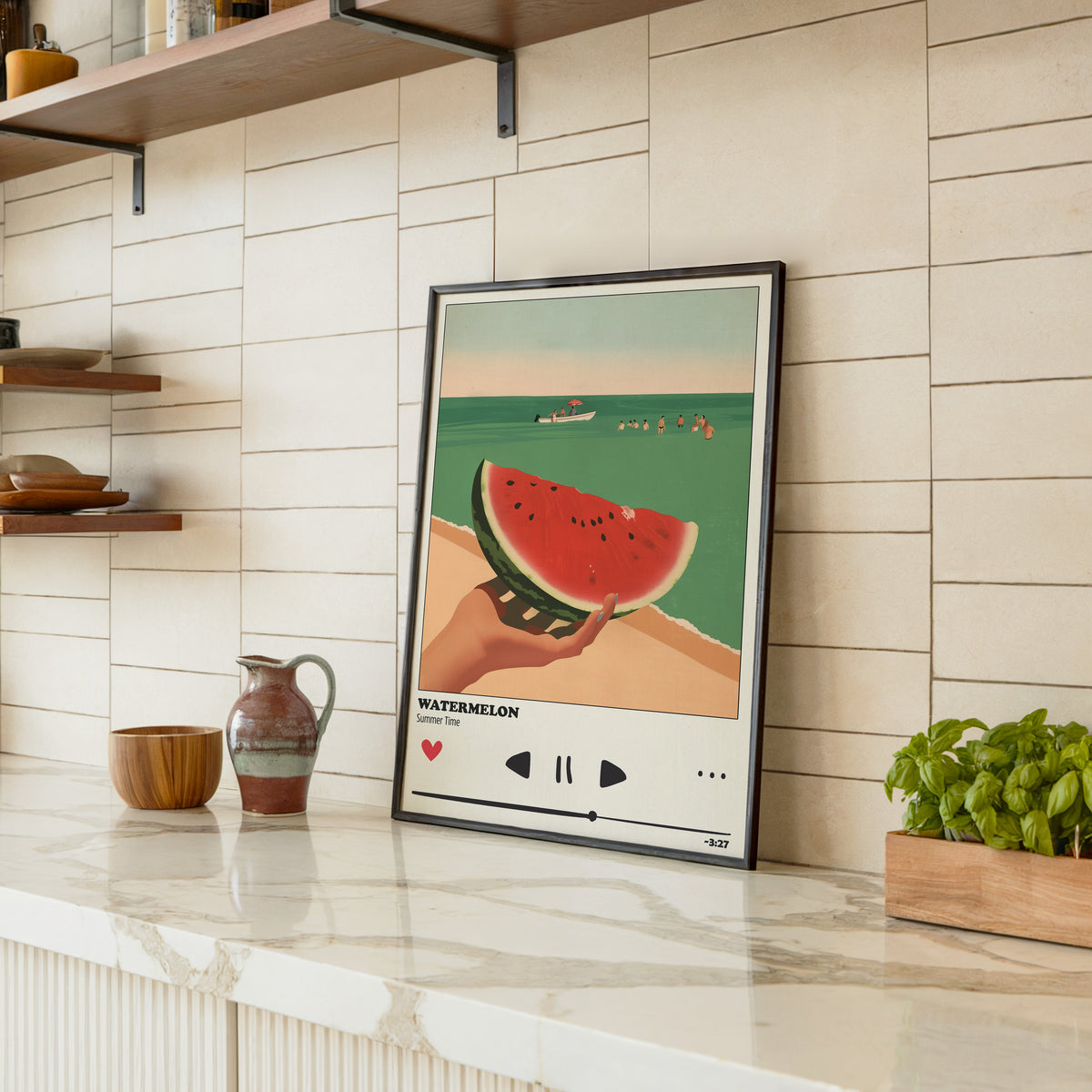 Watermelon Summer print in a black frame leaning on a marble counter in a tiled kitchen