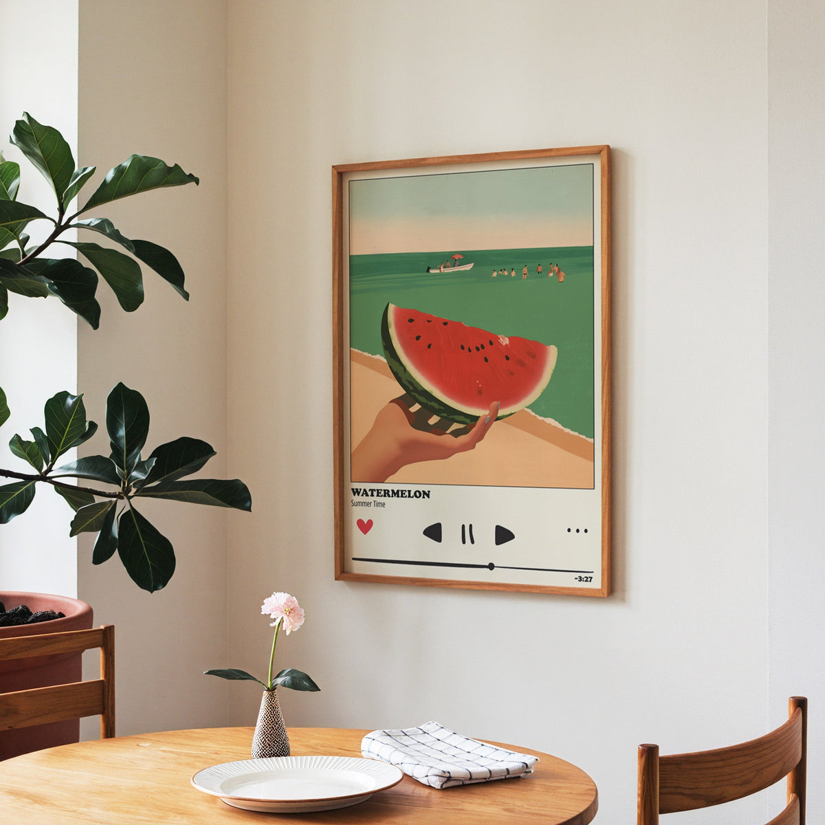 Watermelon Summer print in a walnut frame above a round table beside a fiddle-leaf fig