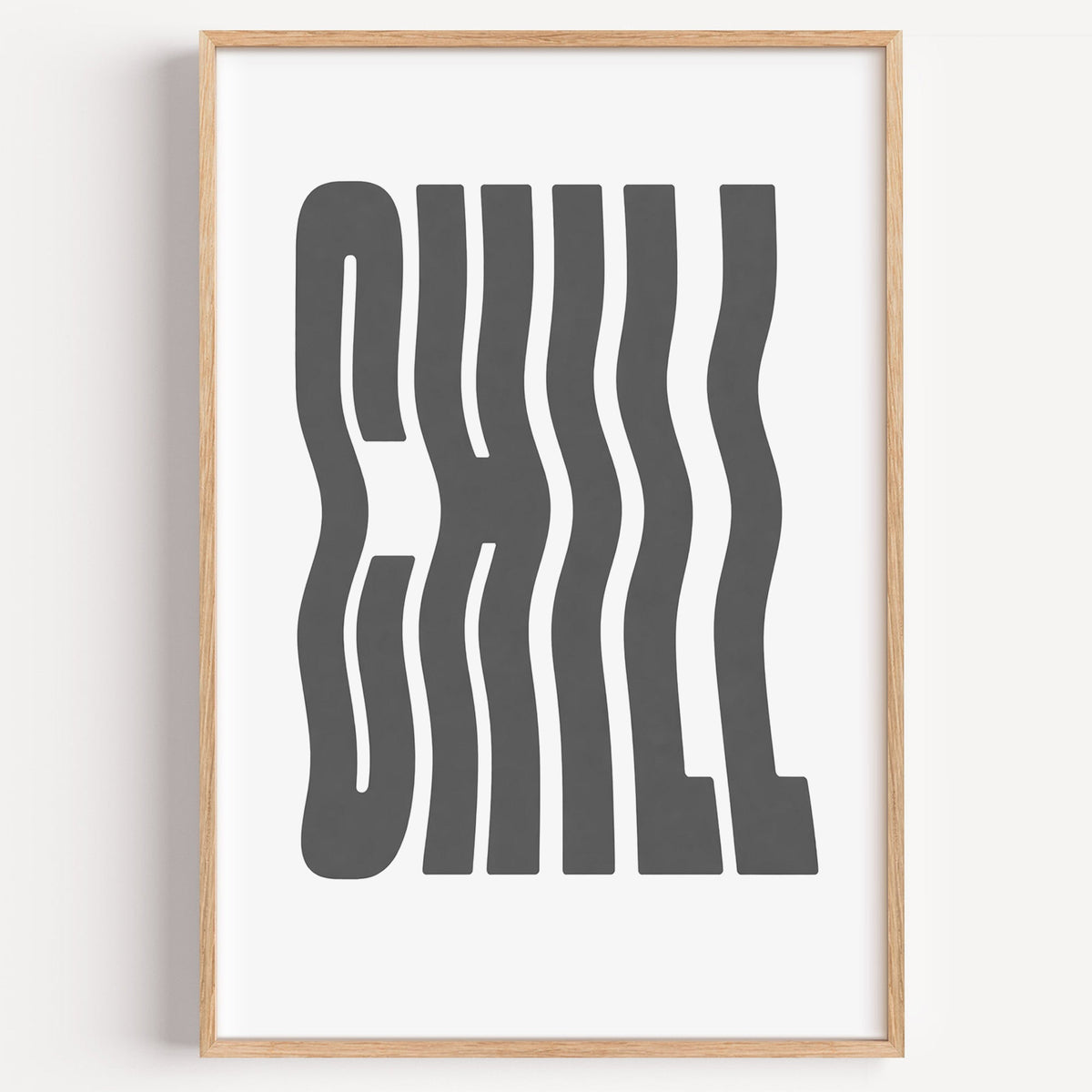 Wavy CHILL lettering on white print in a light oak frame on a plain white wall