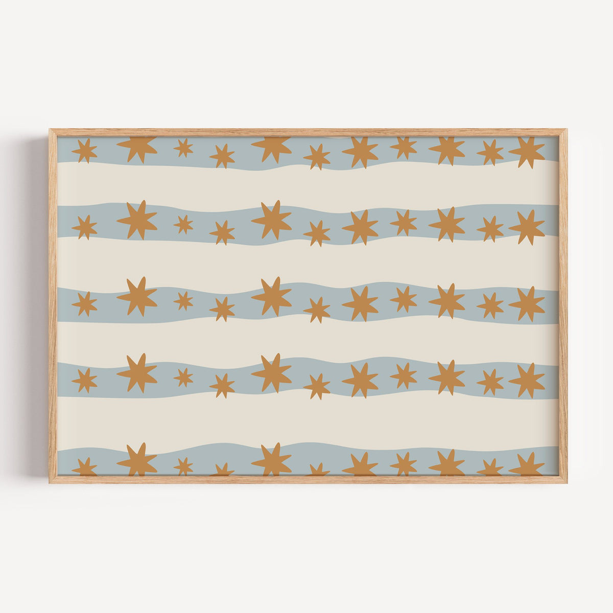 Landscape wavy stripe stars pattern nursery print in a light oak frame on a plain white wall