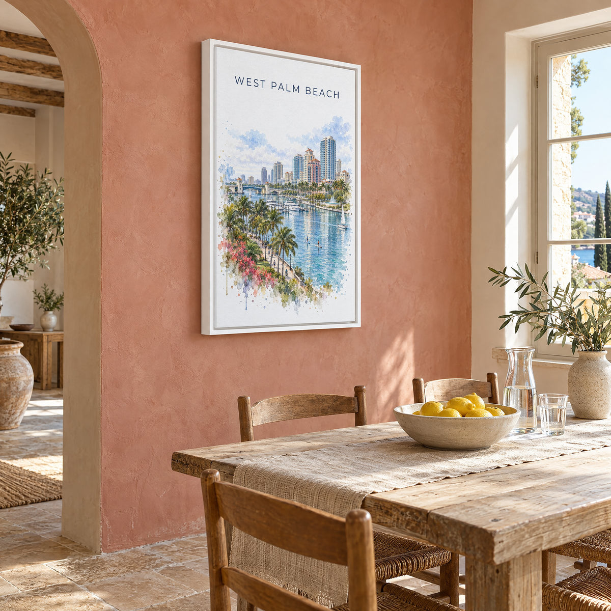 West Palm Beach watercolor print as a white floater canvas on a terracotta wall above a rustic dining table