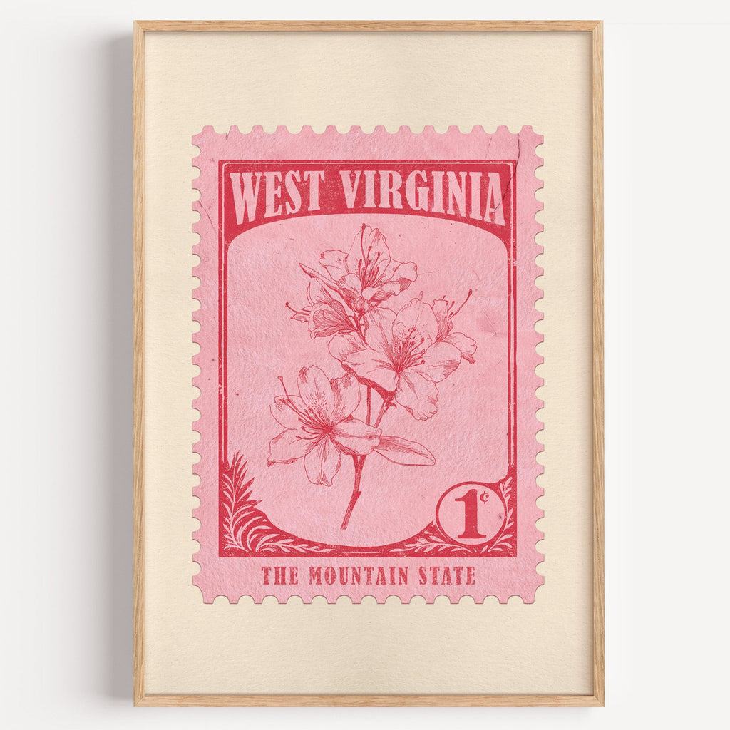 West Virginia state flower stamp print in crimson on pink, light oak frame on a plain white wall