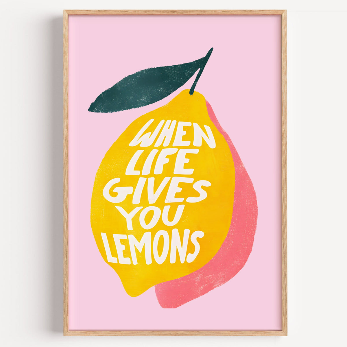 When Life Gives You Lemons print in a light oak frame on a plain white wall