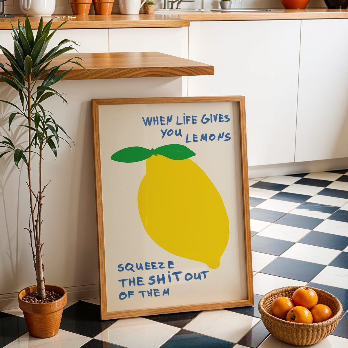 When life gives you lemons print in an oak frame by a kitchen island