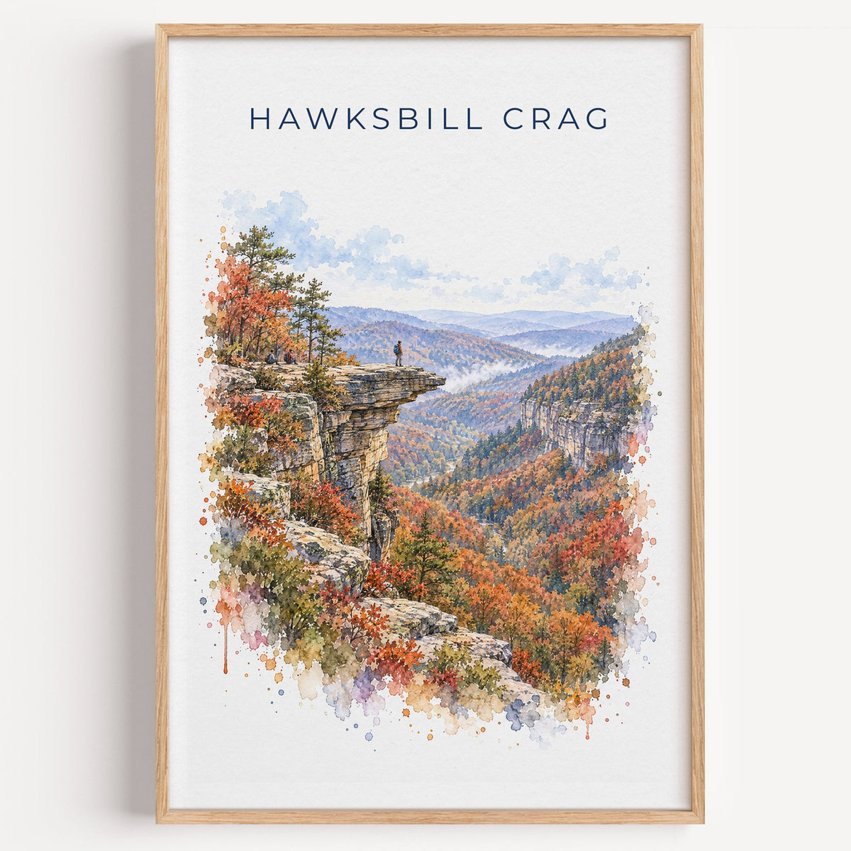 Hawksbill Crag watercolor print in a light oak frame on a plain white wall