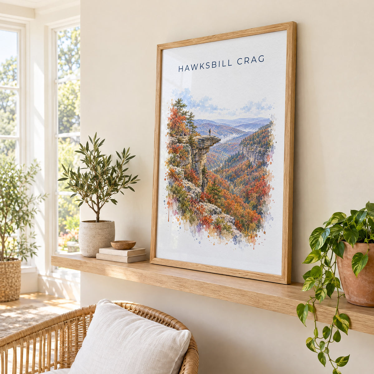 Hawksbill Crag watercolor print in an oak frame on a picture ledge in a sunlit sunroom