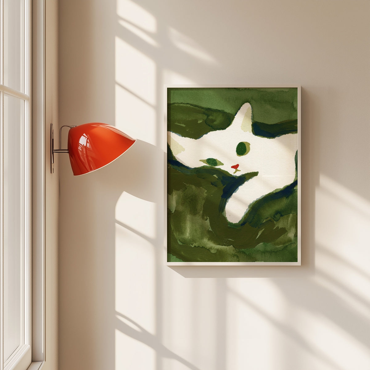 White cat watercolor print in a white frame beside a red wall sconce