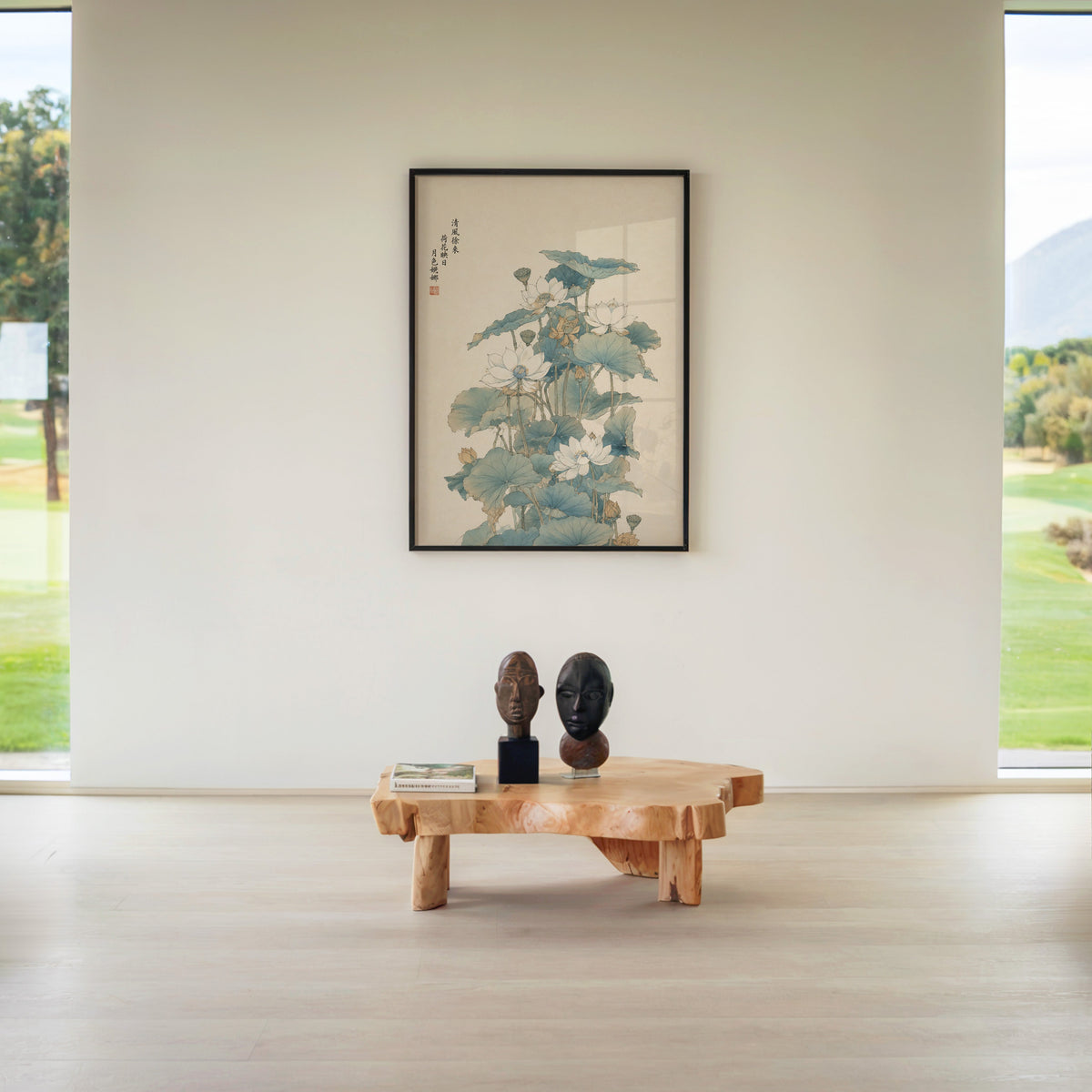 white lotus pond with verse print in a black frame above a live-edge wood coffee table between garden windows