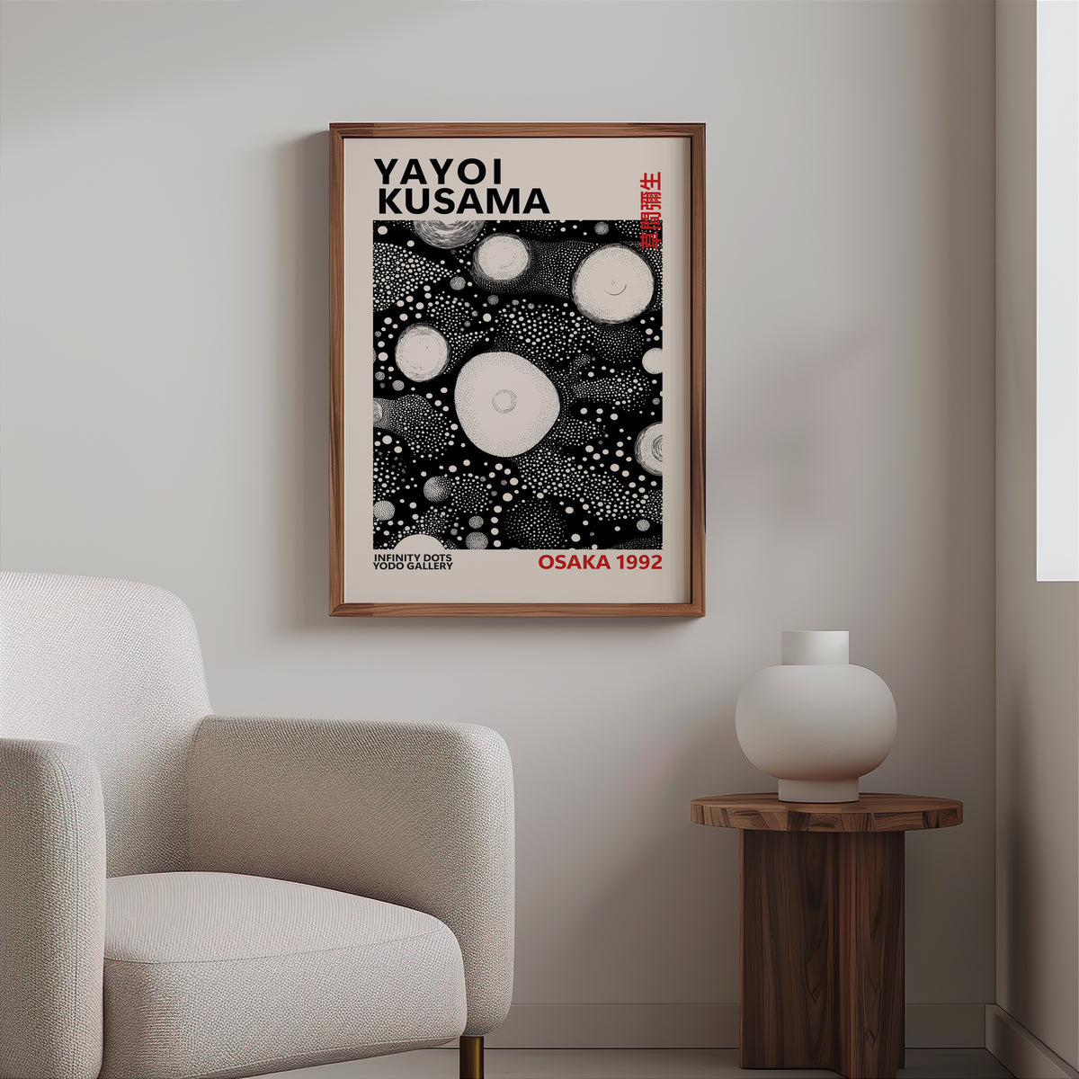 Yayoi Kusama inspired white orbs on black print above a cream boucle armchair