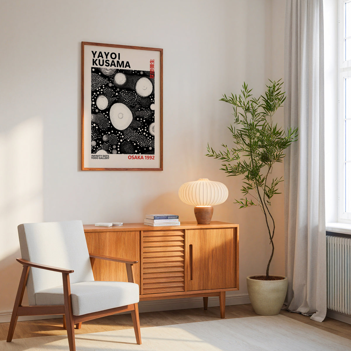 Yayoi Kusama inspired white orbs on black print above a mid-century sideboard