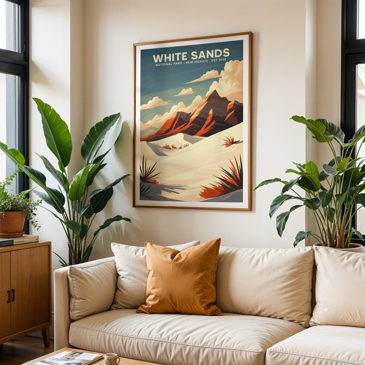 White Sands National Park print in an oak frame above a cream living room sofa with an ochre cushion