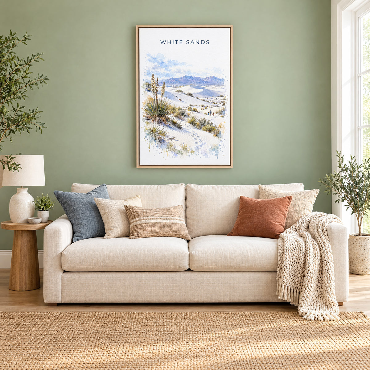 White Sands National Park watercolor print as a natural floater canvas above a cream linen sofa on a sage green wall