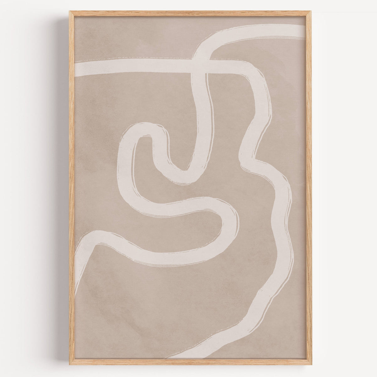 White squiggle brushstroke on taupe boho print in a light oak frame on a plain white wall