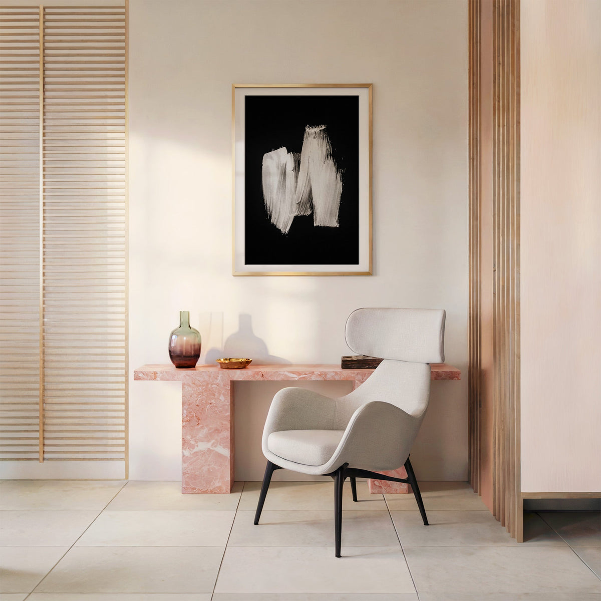 White zigzag brushstroke on black print shown in a gold frame with a mat above a pink marble console and armchair