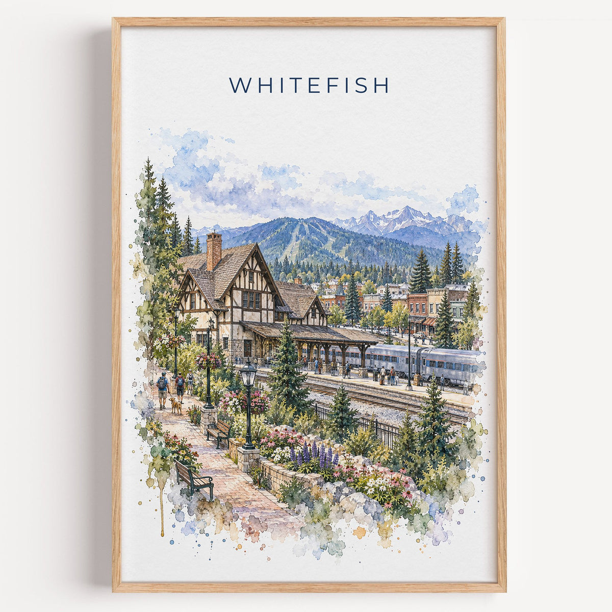 Whitefish watercolor print in a light oak frame on a plain white wall