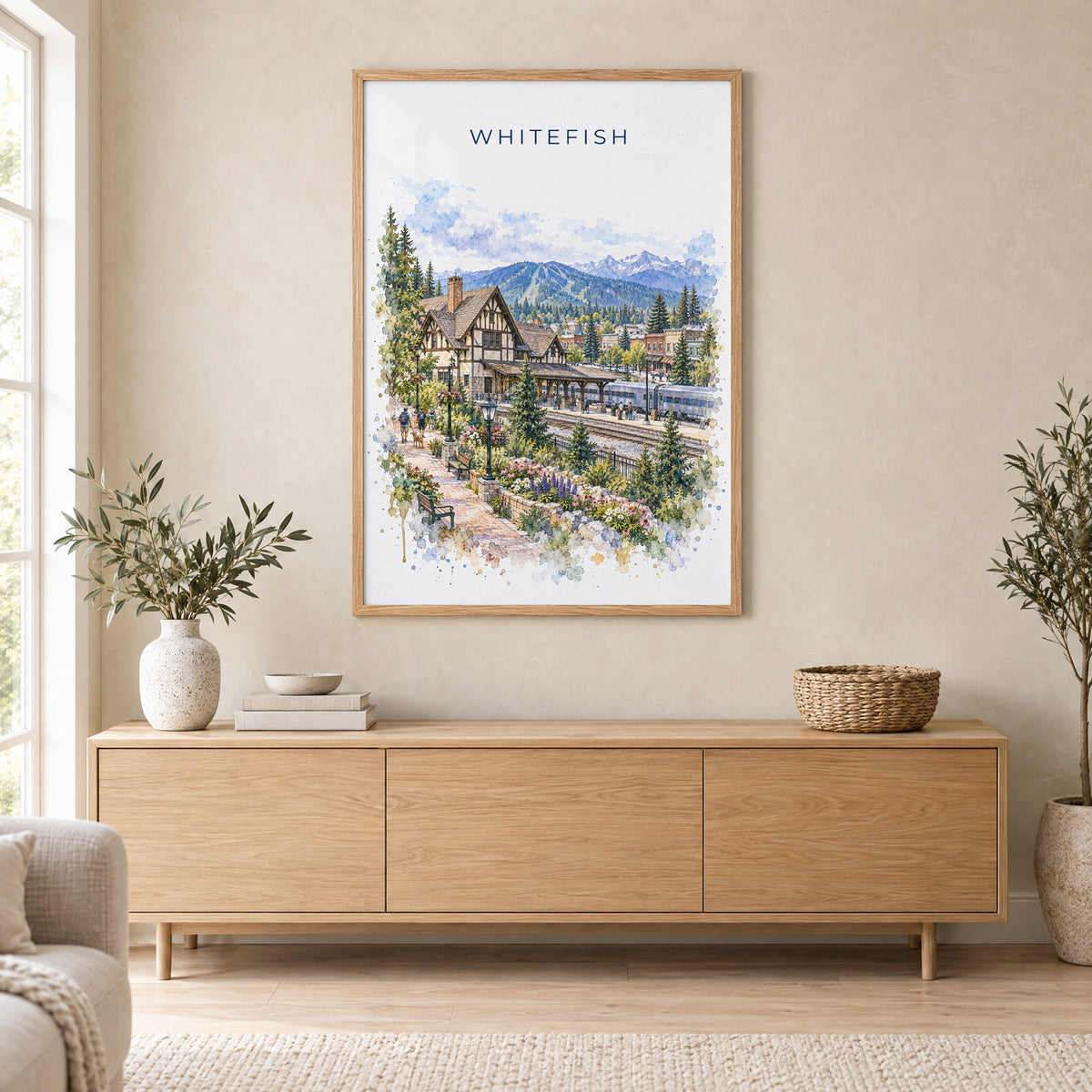 Whitefish watercolor print in an oak frame above a light wood sideboard in a Scandinavian living room