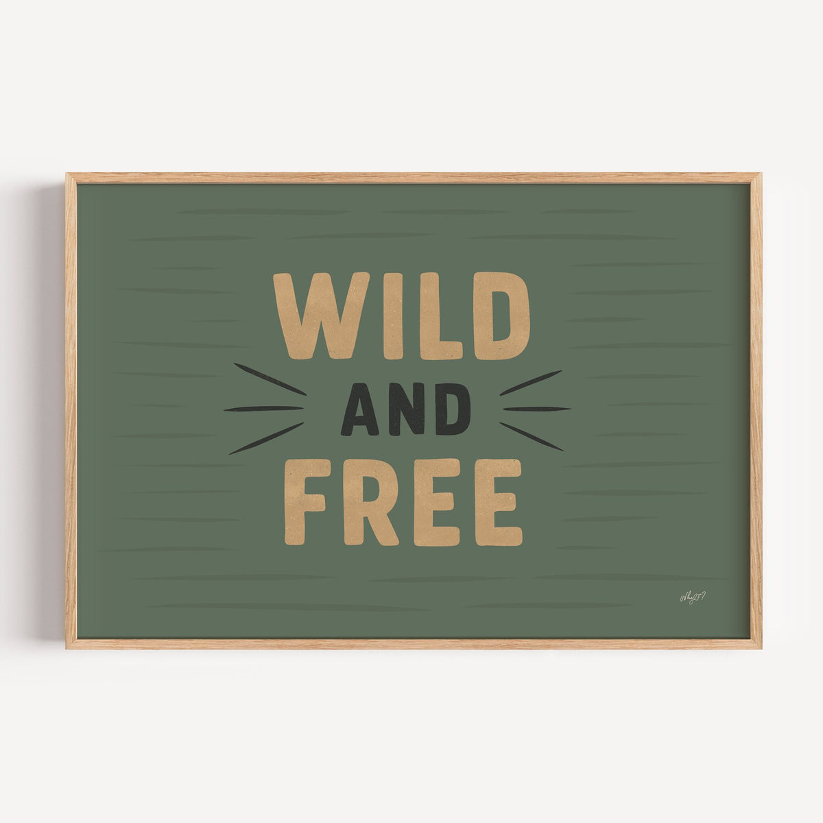 Wild and free sage green quote nursery print in a light oak frame on a plain white wall
