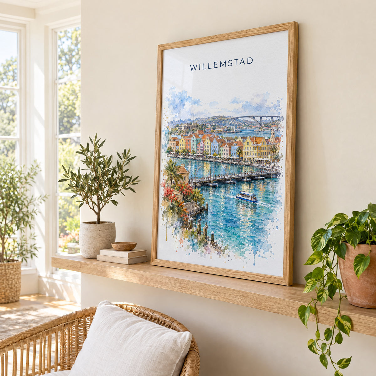 Willemstad watercolor print in an oak frame on a picture ledge in a sunlit sunroom