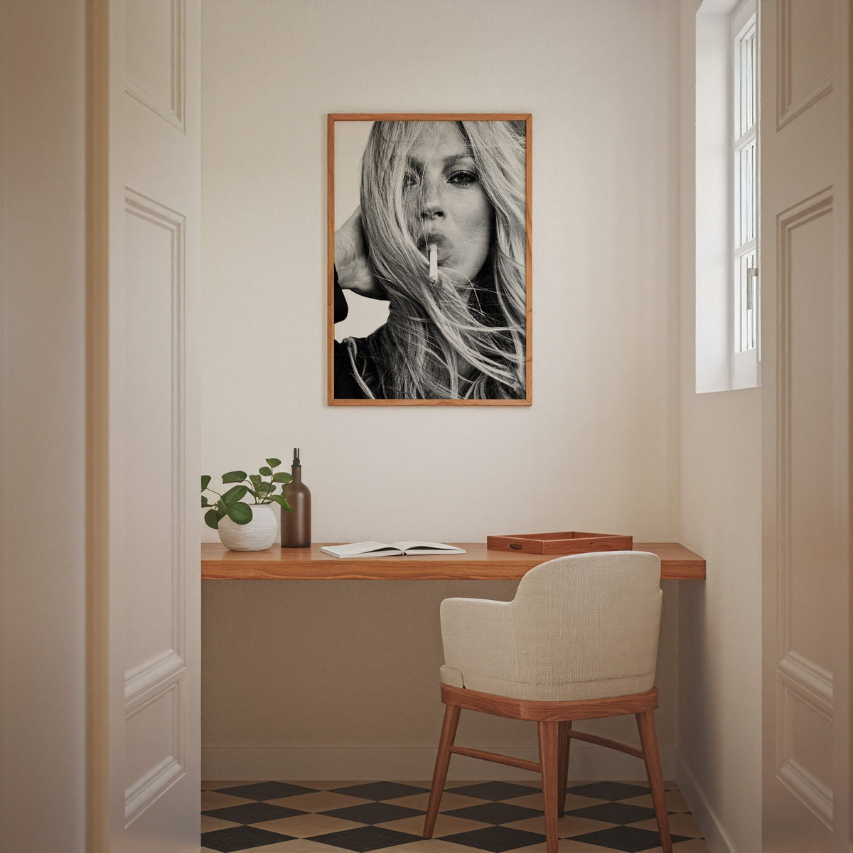Woman with windswept hair across her face print in an oak frame above a home office desk nook
