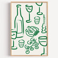 Wine and cheese green pattern print in a light oak frame on a plain white wall