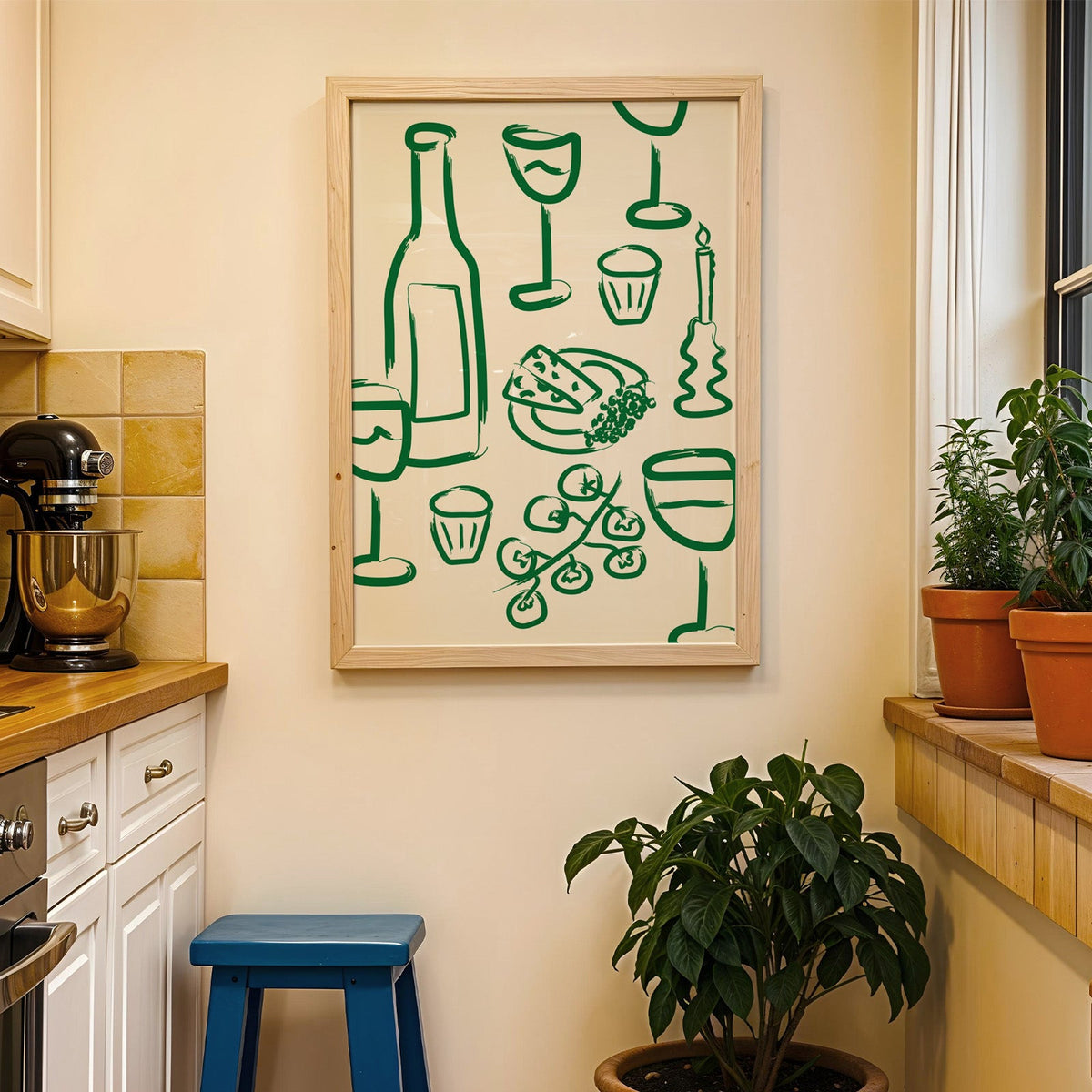 Wine and cheese green pattern print in a wood frame on a yellow tiled kitchen wall