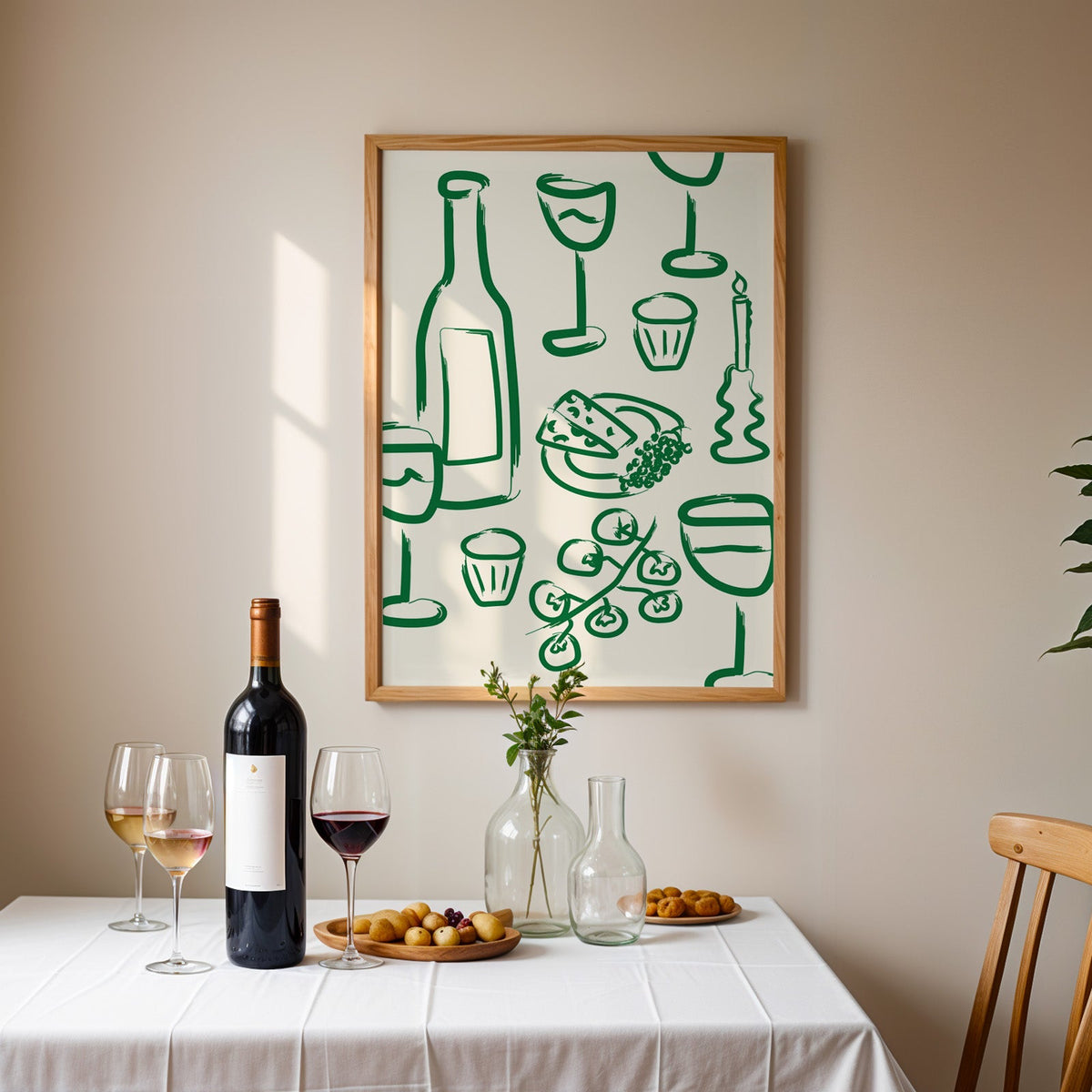 Wine and cheese green pattern print in an oak frame above a table laid with red wine