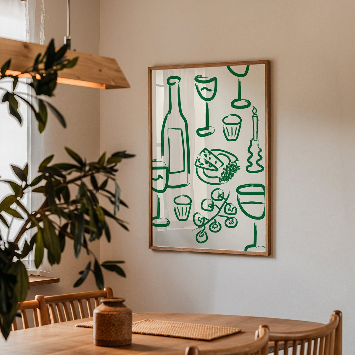Wine and cheese green pattern print in a walnut frame above a table by an olive tree