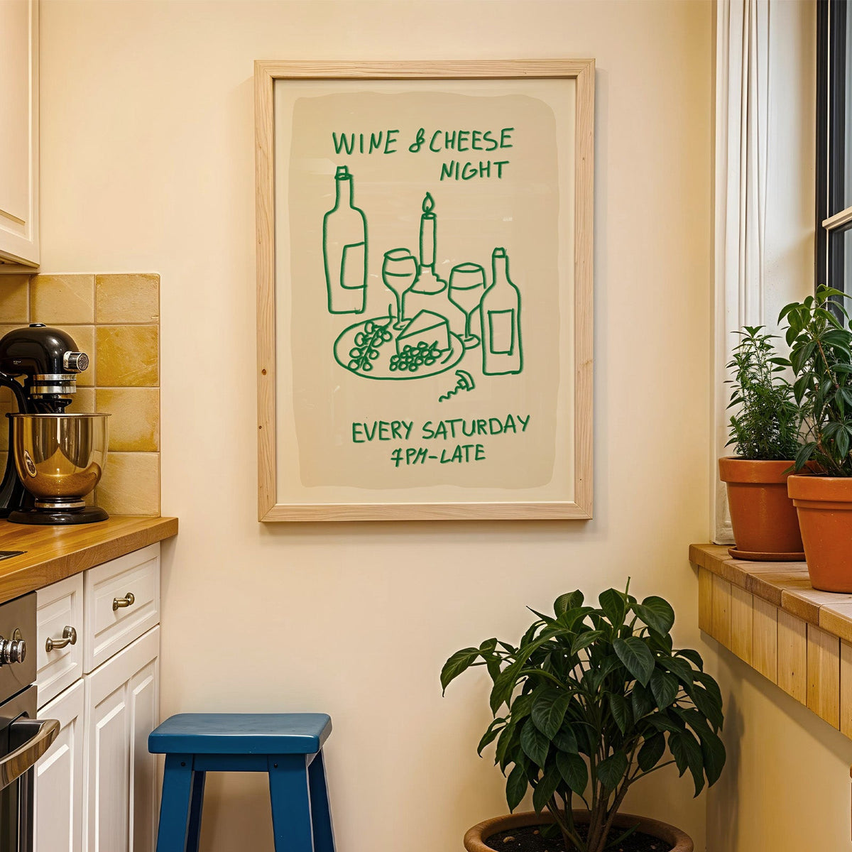 Wine and cheese night print in a wood frame on a yellow tiled kitchen wall
