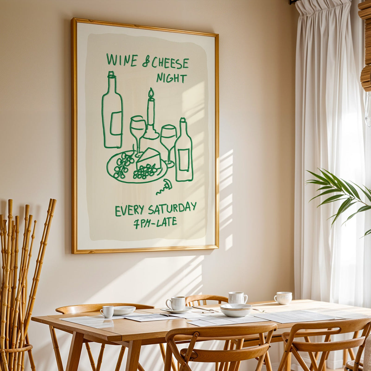 Wine and cheese night print in a gold frame above a sunlit breakfast table