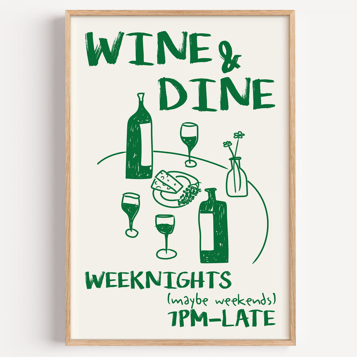 Wine and dine table print in a light oak frame on a plain white wall