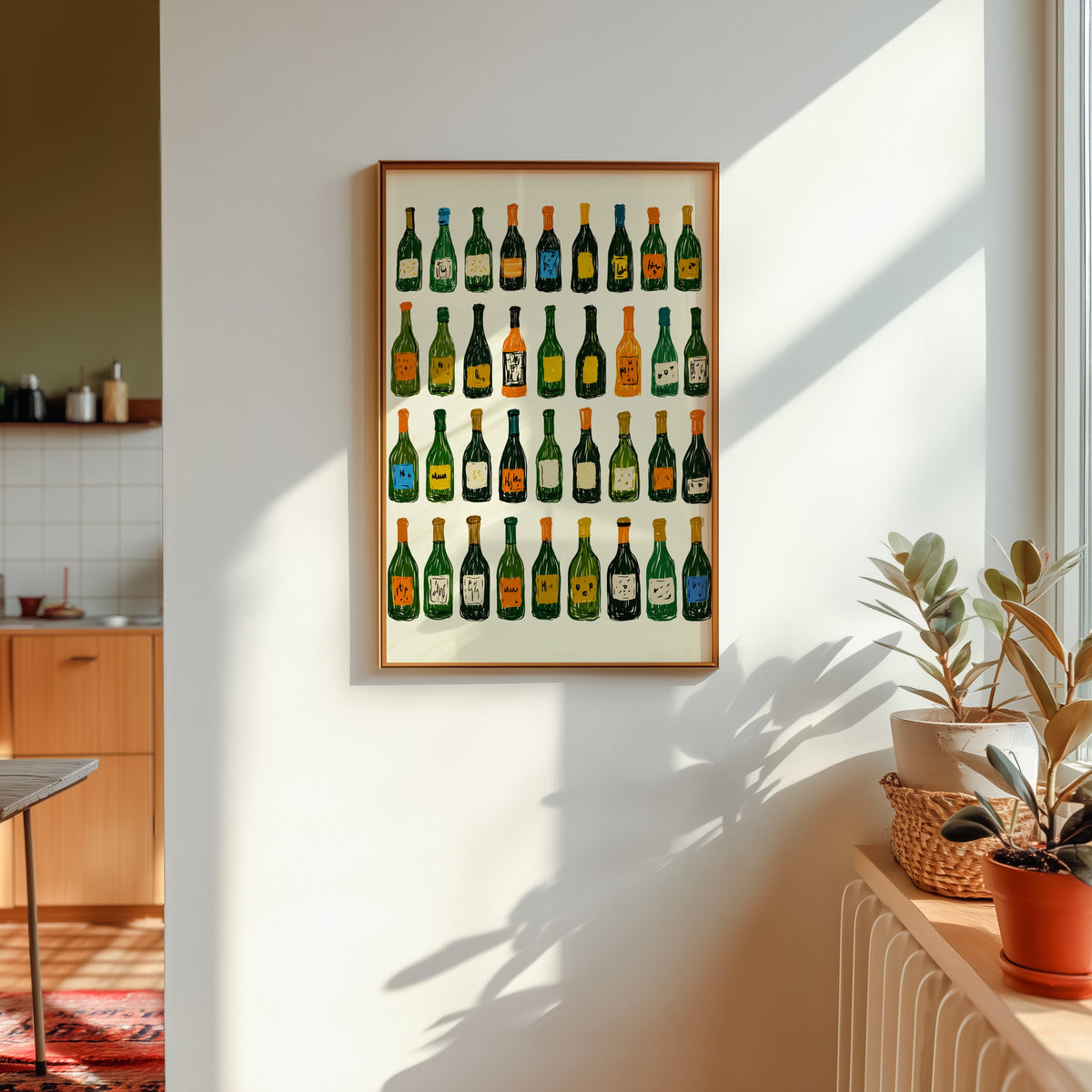 Wine bottle grid print in a gold frame in sunlight with plants and a kitchen beyond