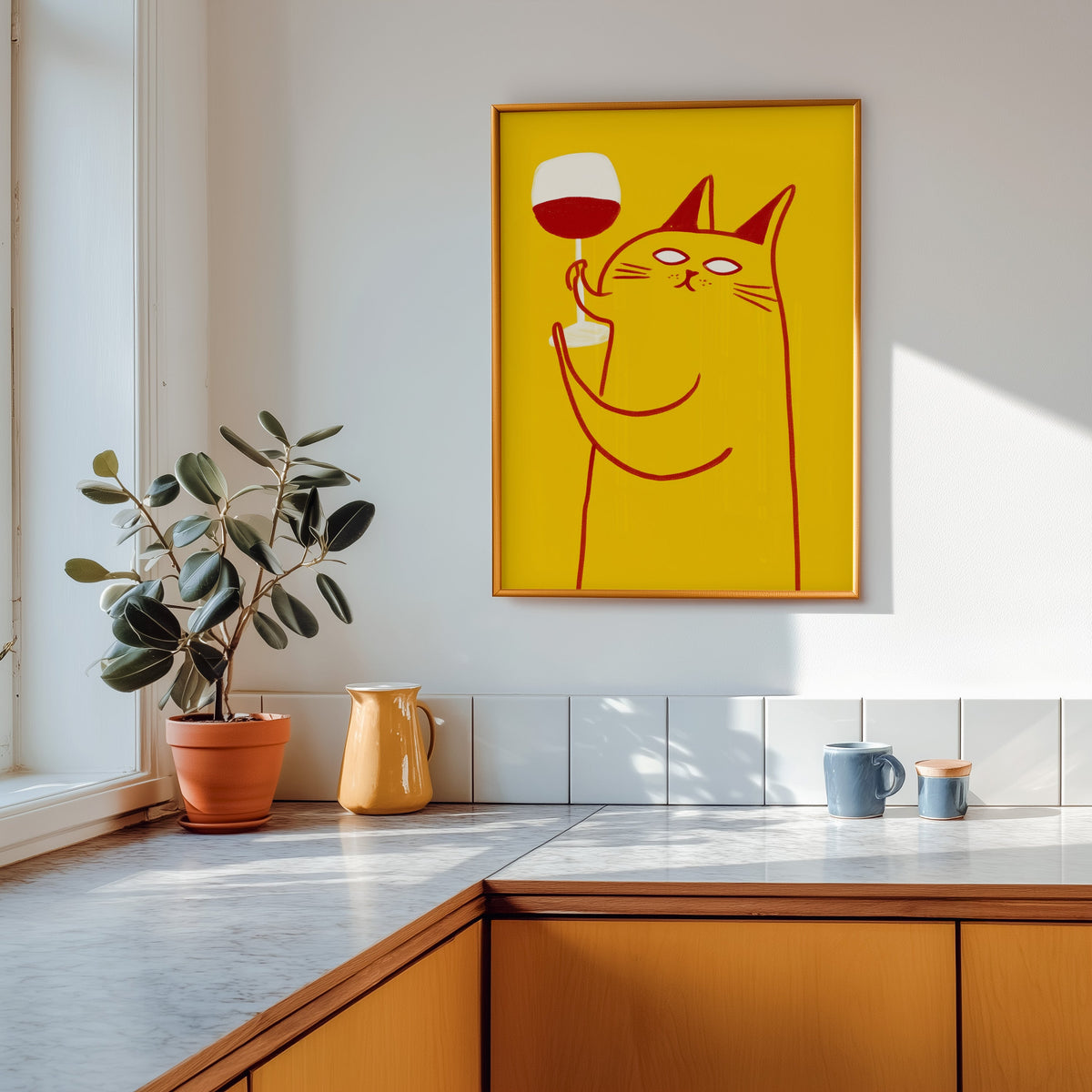 Wine Cat print shown in a gold frame above a marble counter in a tan kitchen