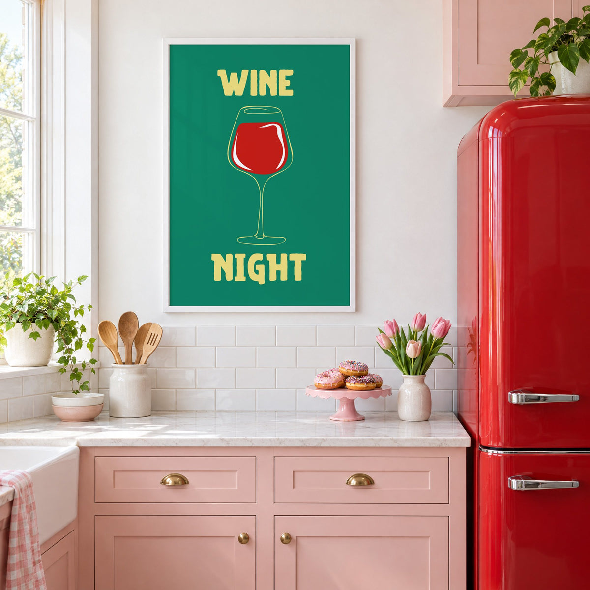 Wine Night red glass print in a white frame in a pink kitchen beside a red retro fridge