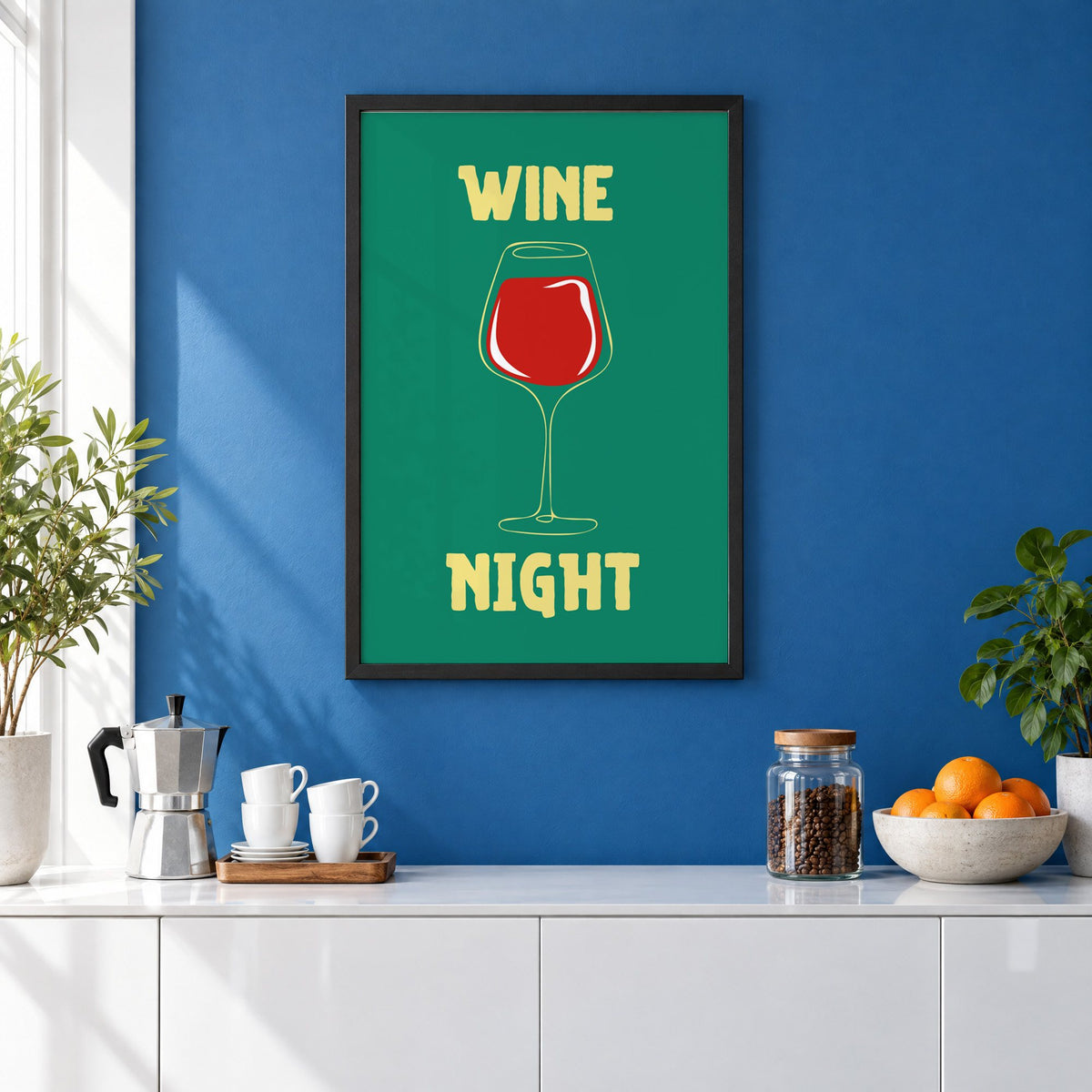 Wine Night red glass print in a black frame on a cobalt blue wall above a coffee station