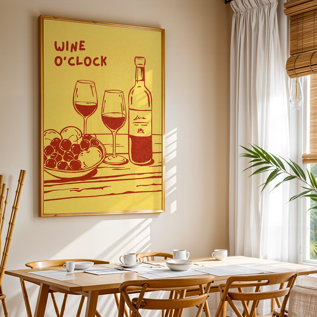 Wine O'Clock print shown in a gold frame above a breakfast table by a curtained window