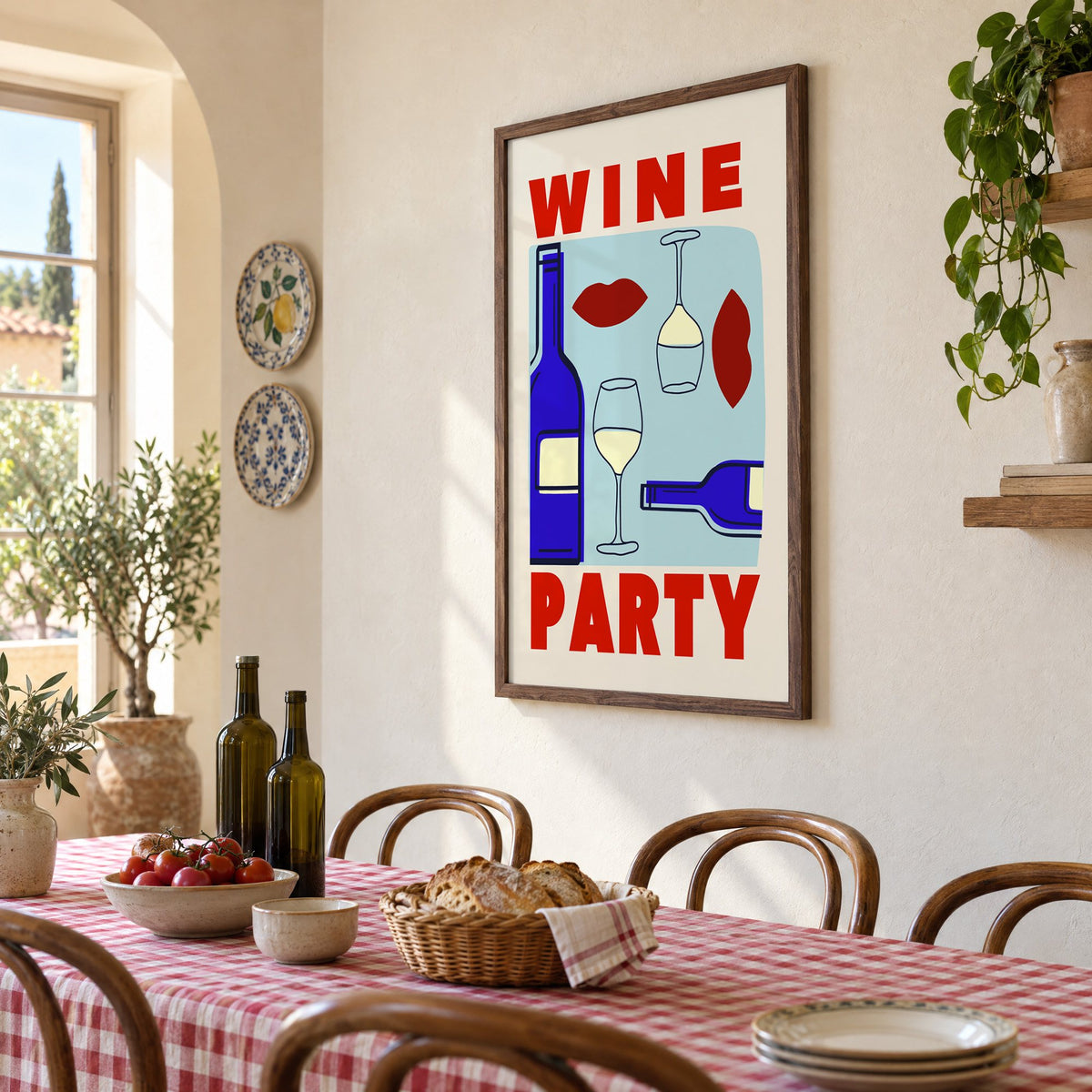Wine Party bottles and red lips print in a walnut frame above a gingham-covered trattoria table, seen at an angle