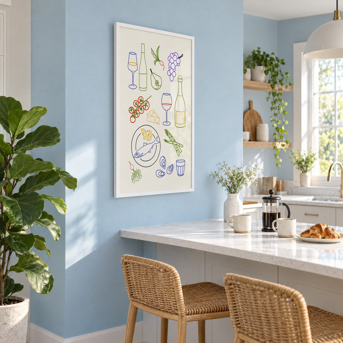 Colorful wine picnic line art print in a white frame on a pale blue wall above a breakfast bar with rattan stools