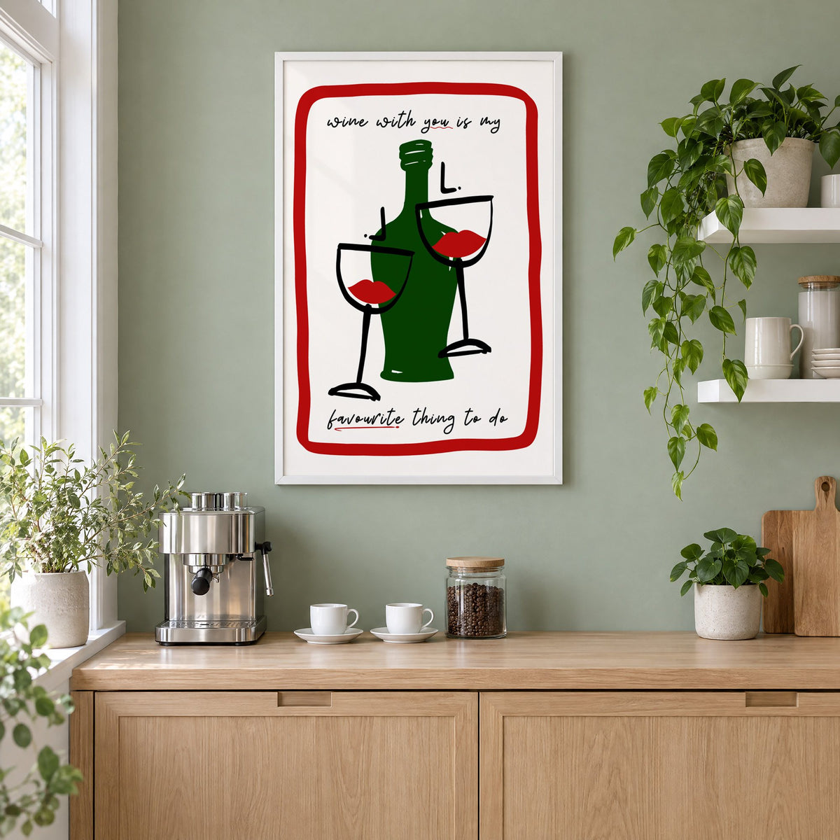 Wine with you lip glasses print in a white frame on a sage green coffee nook wall above an espresso machine