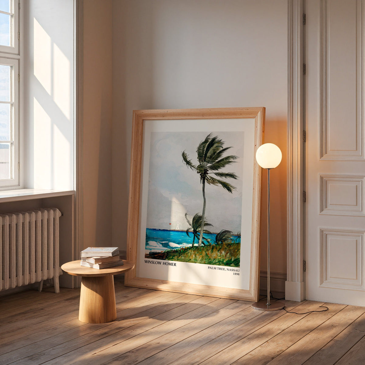 Homer palm print in a wide pine frame leaning by a sunlit window