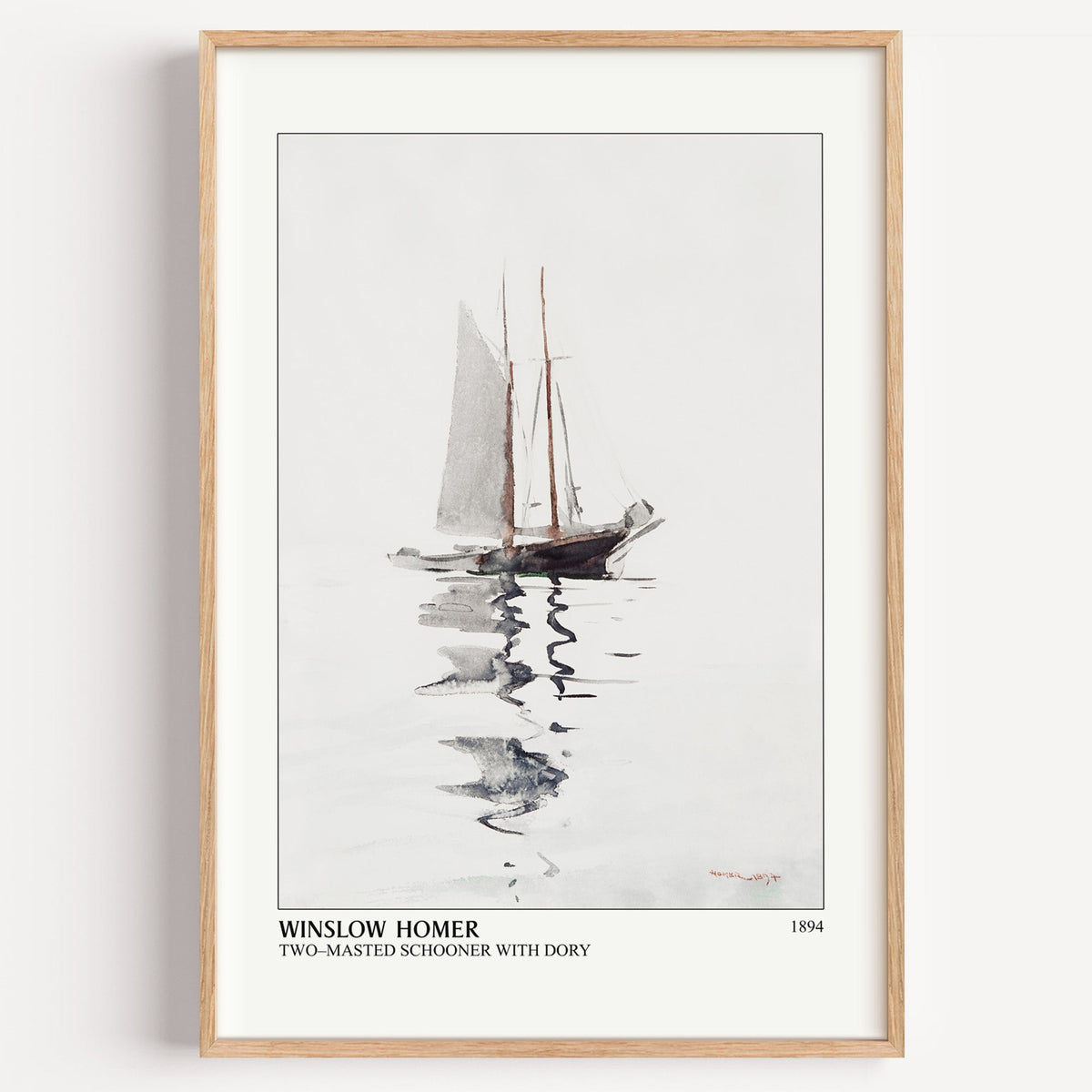 Winslow Homer Two-Masted Schooner print in a light oak frame on a white wall