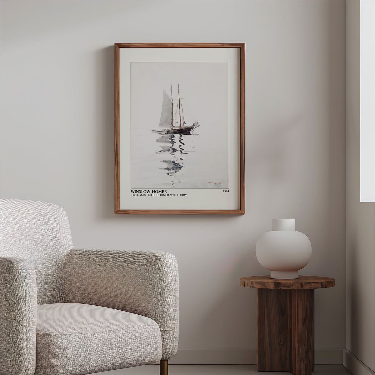Homer schooner watercolour in a slim walnut frame above a bouclé armchair