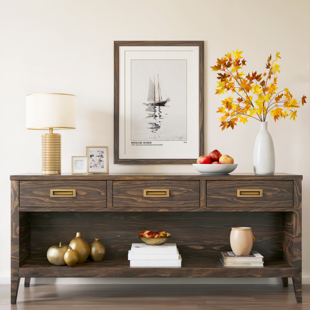 Two-Masted Schooner print in a walnut frame above a console with branches