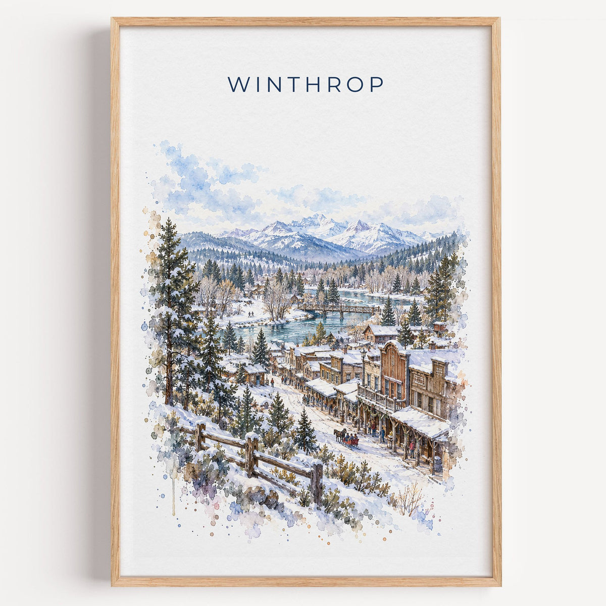Winthrop, Washington watercolor print in a light oak frame on a plain white wall